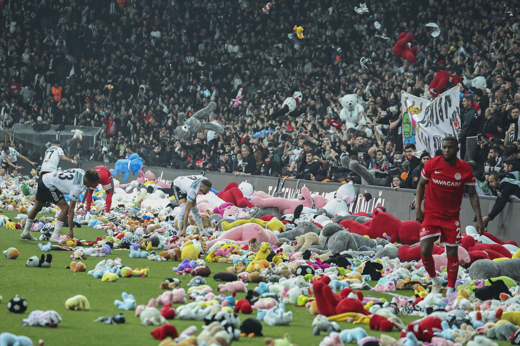 Turkish soccer fans throw stuffed animals on the field, vent dissatisfaction with government quake response